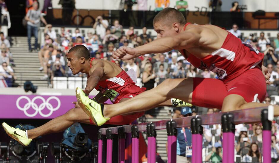 United States' Ashton Eaton, and United States' Trey Hardee compete in a 110-meter hurdles heat in the decathlon during the athletics in the Olympic Stadium at the 2012 Summer Olympics, London.