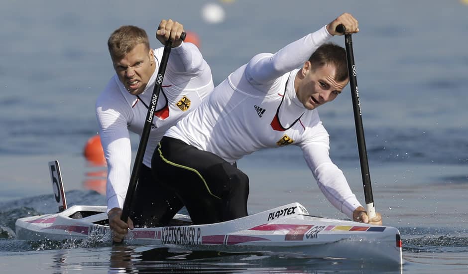 Germany's Peter Kretschmer and Kurt Kuschela paddle on their way to winning the gold medal men's kayak double 1000m in Eton Dorney, near Windsor, England, at the 2012 Summer Olympics.