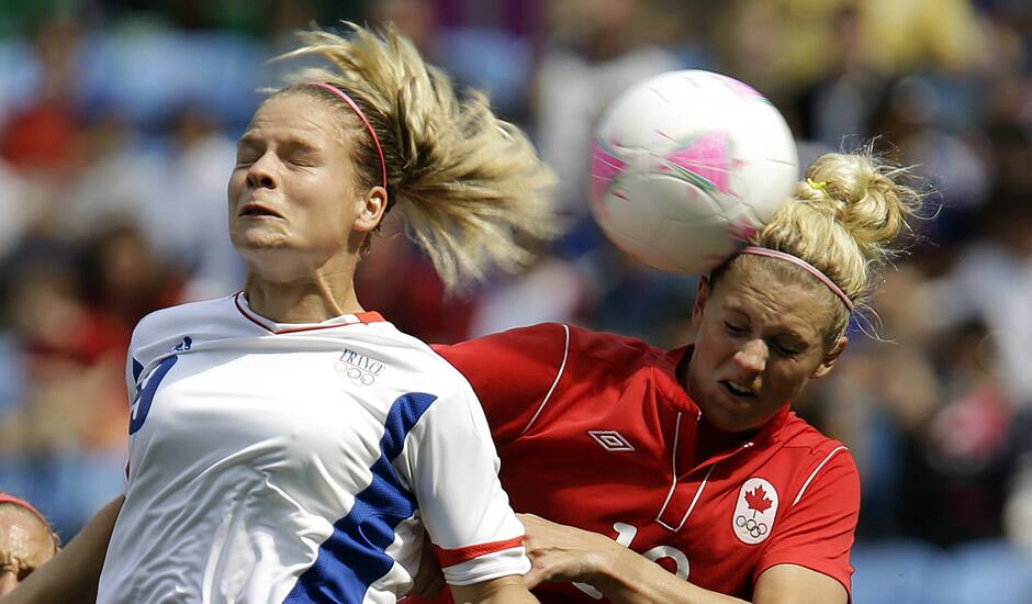 France's Eugenie Le Sommer, heads the ball against Canada's Lauren Sesselmann, right, during their women's bronze medal soccer match at the 2012 London Summer Olympics, in Coventry, England.