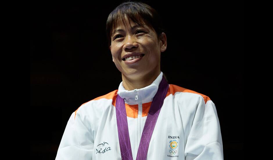 Bronze medalist, Chungneijang Mery Kom Hmangte, participates in the medals ceremony for women`s final flyweight 51-kg gold medal boxing match at the 2012 Summer Olympics.