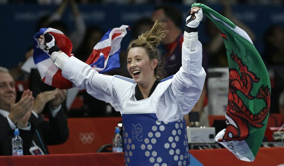 Britain's Jade Jones celebrates after defeating China's Hou Yuzhuo in their gold medal match in women's 57-kg taekwondo competition at the 2012 Summer Olympics.