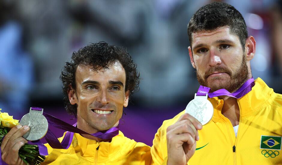 Brazil's Alison, right, and Emanuel, left, display their silver medals after the men's gold medal beach volleyball match at the 2012 Summer Olympics.