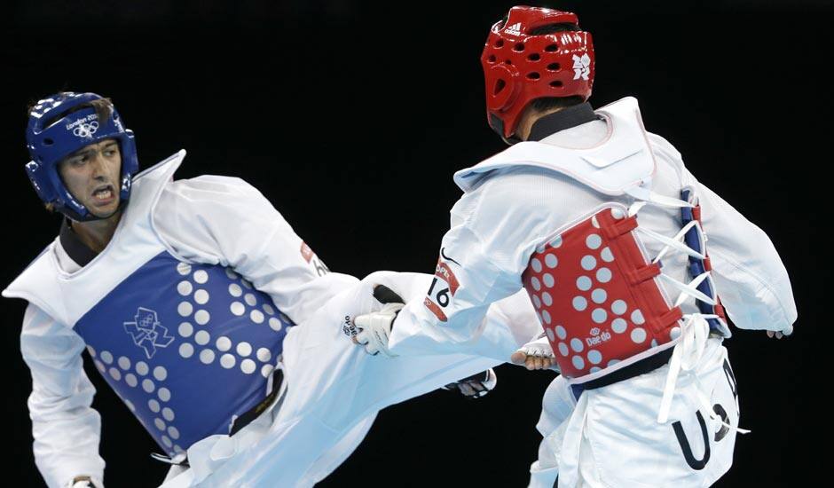 Azerbaijan's Ramin Azizov fights United States' Steven Lopez (in red) during their match in men's 80-kg taekwondo competition at the 2012 Summer Olympics.