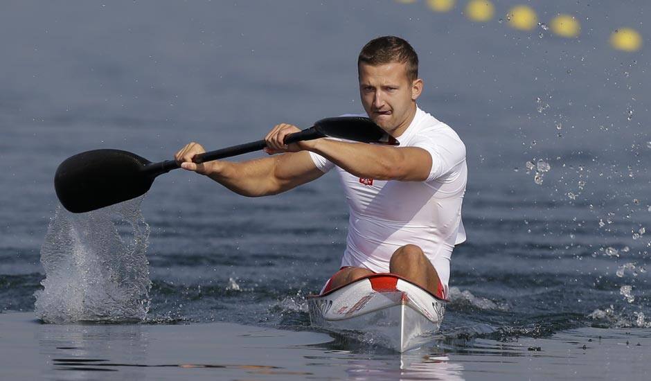 Poland's Piotr Siemionowski paddles in a men's kayak single 200m heat in Eton Dorney, near Windsor, England, at the 2012 Summer Olympics.