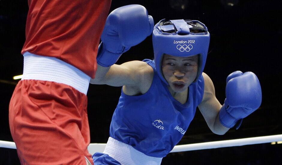 Mery Kom Hmangte, fights Tunisia's Maroua Rahali in a women's flyweight 51-kg quarterfinal boxing match at the 2012 Summer Olympics in London.