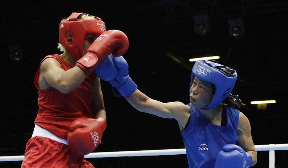 Mery Kom Hmangte, fights Tunisia's Maroua Rahali during a women's flyweight 51-kg quarterfinal boxing match at the 2012 Summer Olympics in London. 