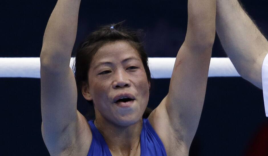 Mery Kom Hmangte celebrates after defeating Tunisia's Maroua Rahali in a women's flyweight 51-kg quarterfinal boxing match at the 2012 Summer Olympics in London.