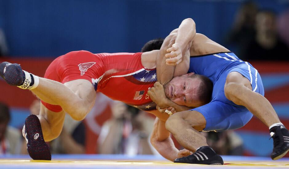 United States' Samuel Hazewinkel, red, and Kazakhstan's Daulet Niyazbekov, blue compete during a 55-kg men's freestyle wrestling competition at the 2012 Summer Olympics in London.