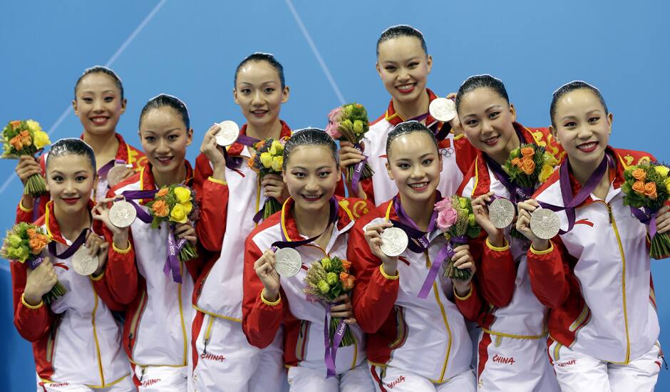 The team of China and winner of the silver medal poses during he medal ceremony for the women's team synchronized swimming free routine at the Aquatics Centre in the Olympic Park during the 2012 Summer Olympics in London.