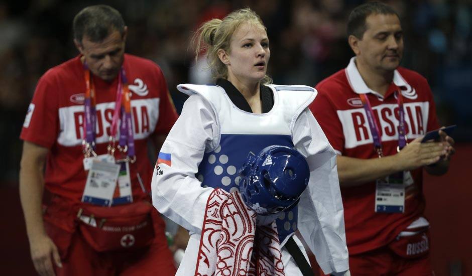 Russia's Anastasia's Baryshinkova walks off the mat after fighting Tunisia's Khaoula Ben Hamza in women's plus 67-kg taekwondo competition at the 2012 Summer Olympics.