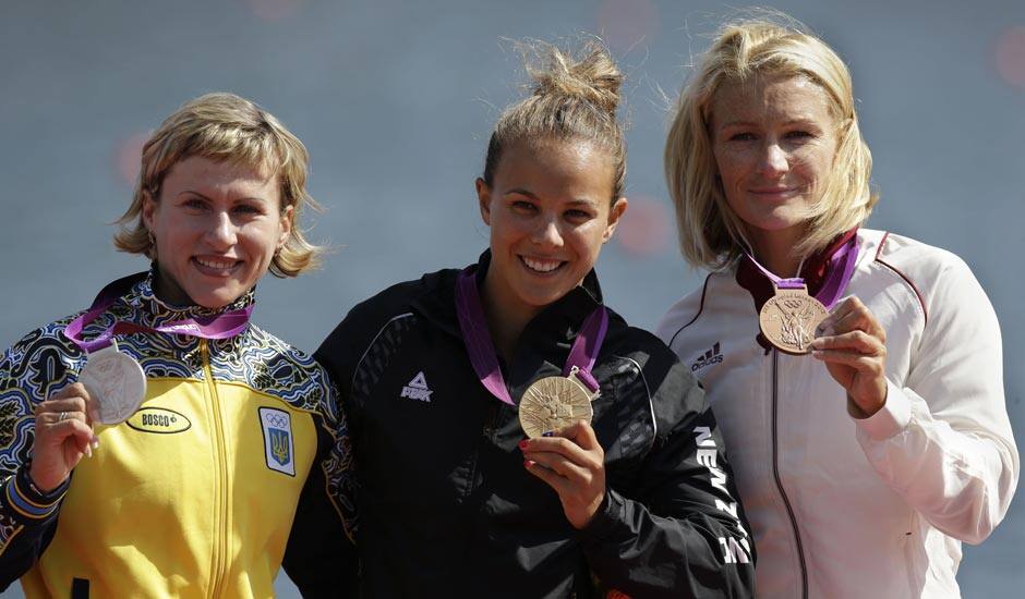 Winners of the women's kayak single 200m pose at the podium in Eton Dorney, near Windsor, England, at the 2012 Summer Olympics.