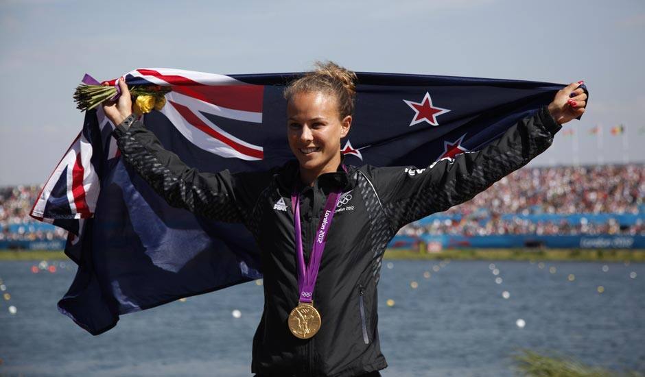 New Zealand's Lisa Carrington celebrates at the podium after winning the gold medal in the women's kayak single 200m in Eton Dorney, near Windsor, England, at the 2012 Summer Olympics.