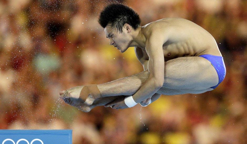 Qiu Bo from China competes during the men's 10-meter platform diving semi final at the Aquatics Centre in the Olympic Park during the 2012 Summer Olympics.