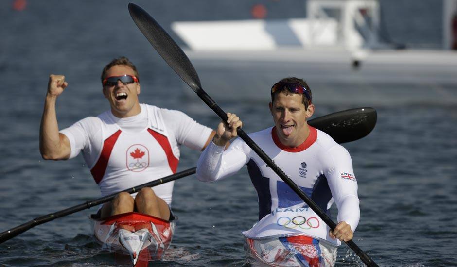 Great Britain's Ed McKeever, right, paddles to the dock with Canada's Mark de Jonge after winning the gold medal men's kayak single 200m in Eton Dorney, near Windsor, England, at the 2012 Summer Olympics.