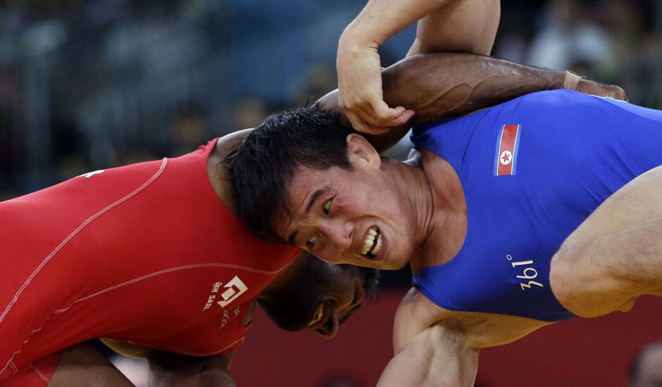 Yogeshwar Dutt of India competes against Ri Jong Myong of North Korea for the bronze medal during the men's 60-kg freestyle wrestling competition at the 2012 Summer Olympics.