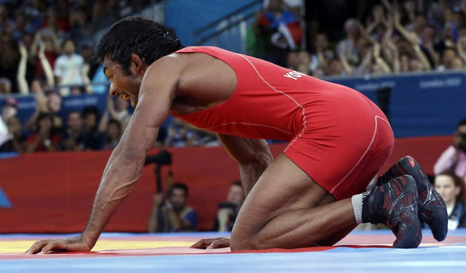 Yogeshwar Dutt of India celebrates after beating Ri Jong Myong of North Korea for the bronze medal during the men's 60-kg freestyle wrestling competition at the 2012 Summer Olympics.