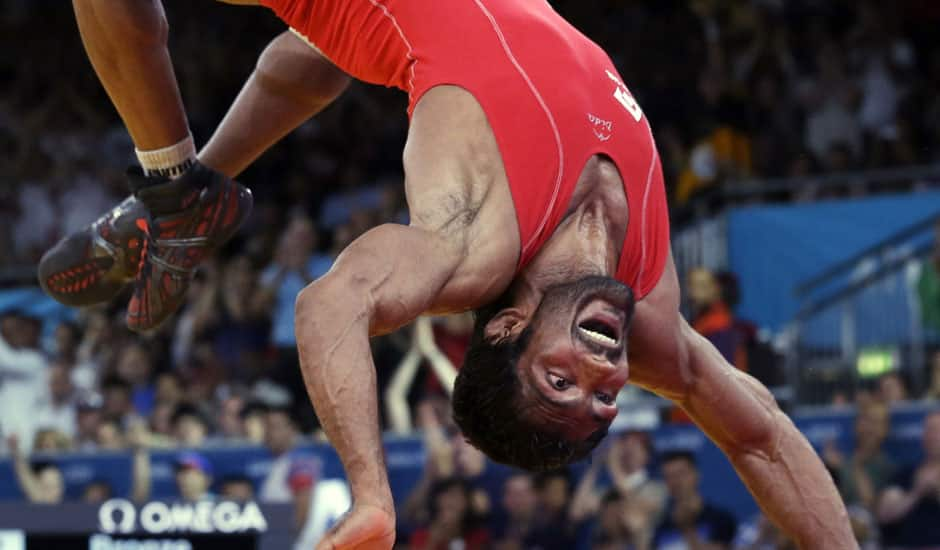 Yogeshwar Dutt of India celebrates after beating Ri Jong Myong of North Korea for the bronze medal during the men's 60-kg freestyle wrestling competition at the 2012 Summer Olympics.