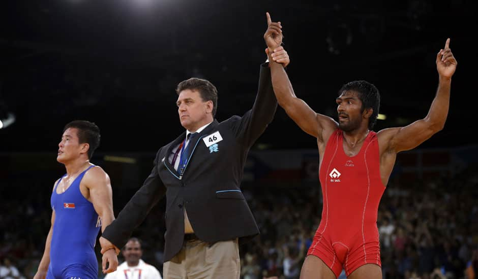 Yogeshwar Dutt of India reacts after beating Ri Jong Myong of North Korea for the bronze medal during the men's 60-kg freestyle wrestling competition at the 2012 Summer Olympics.