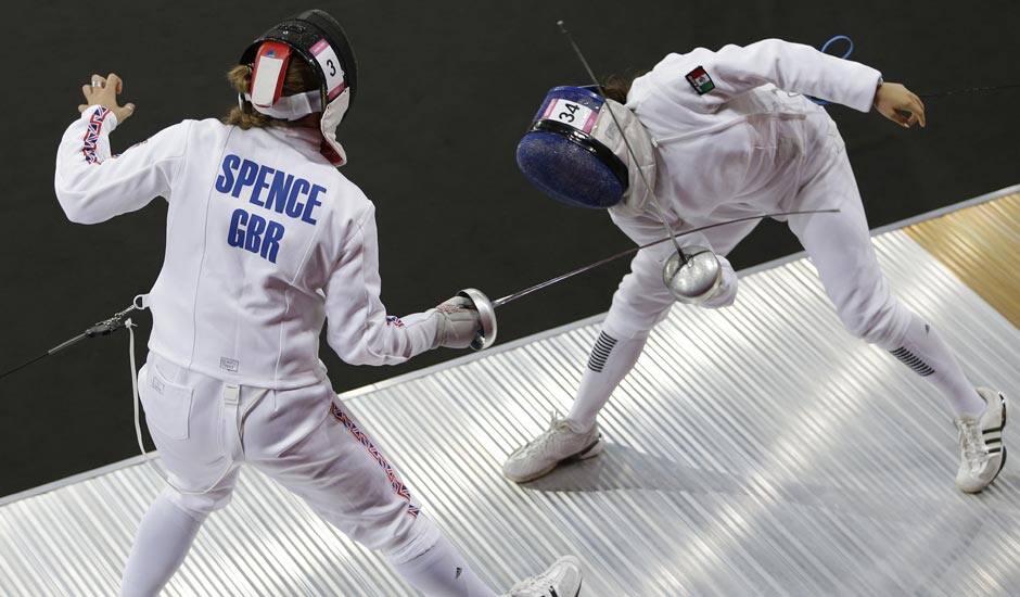 Britain's Mhairi Spence, left, competes against Mexico's Tamara Vega, right, during the fencing portion of the women's modern pentathlon competition at the 2012 Summer Olympics.