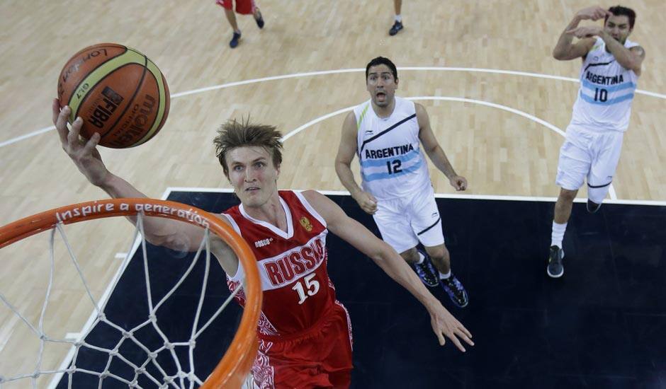 Russia's Andrei Kirilenko (15) drives to the basket against Argentina during a men's bronze medal basketball game at the 2012 Summer Olympics.