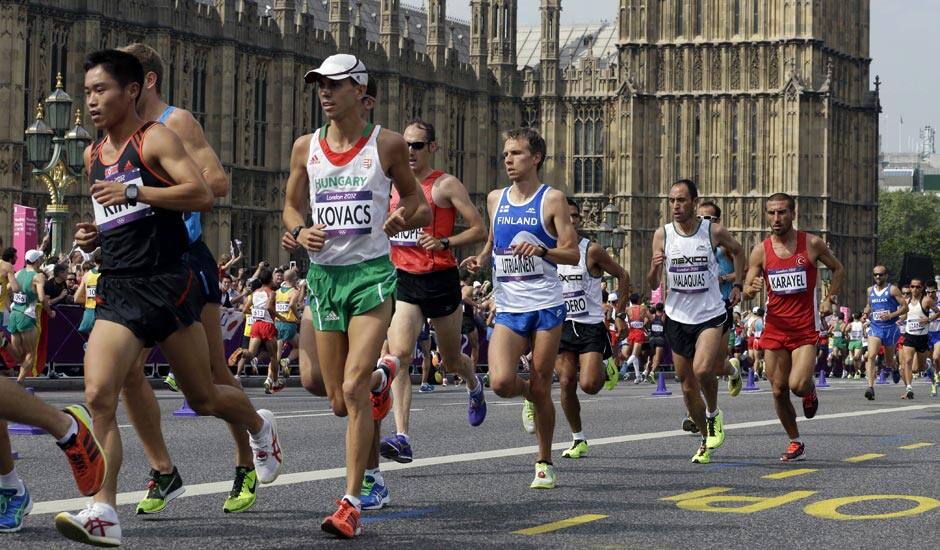 South Korea's Kim Kwang-hyok runs near Big Ben during the men's marathon at the 2012 Summer Olympics in London.