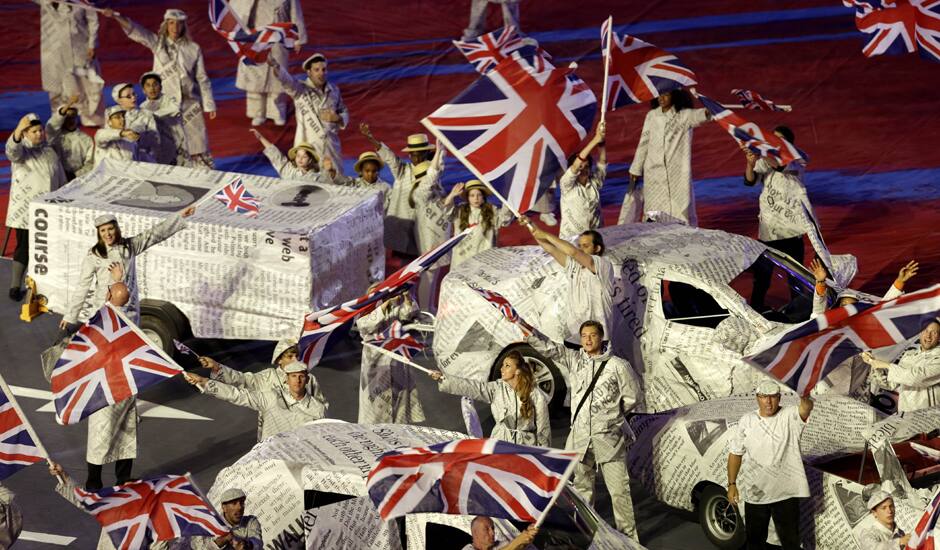 Performers wave the British Flag during the Closing Ceremony at the 2012 Summer Olympics, Sunday, Aug. 12, 2012, in London