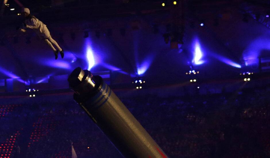 A performer is airborne during the Closing Ceremony at the 2012 Summer Olympics, Sunday, Aug. 12, 2012, in London.