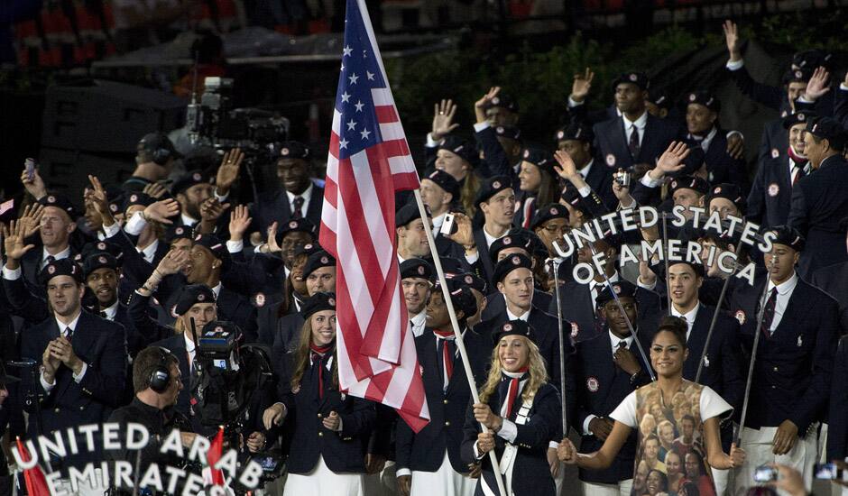 Fencer Mariel Zagunis leads Team USA into the stadium during the Opening Ceremony for the 2012 Olympic Summer Games in London.