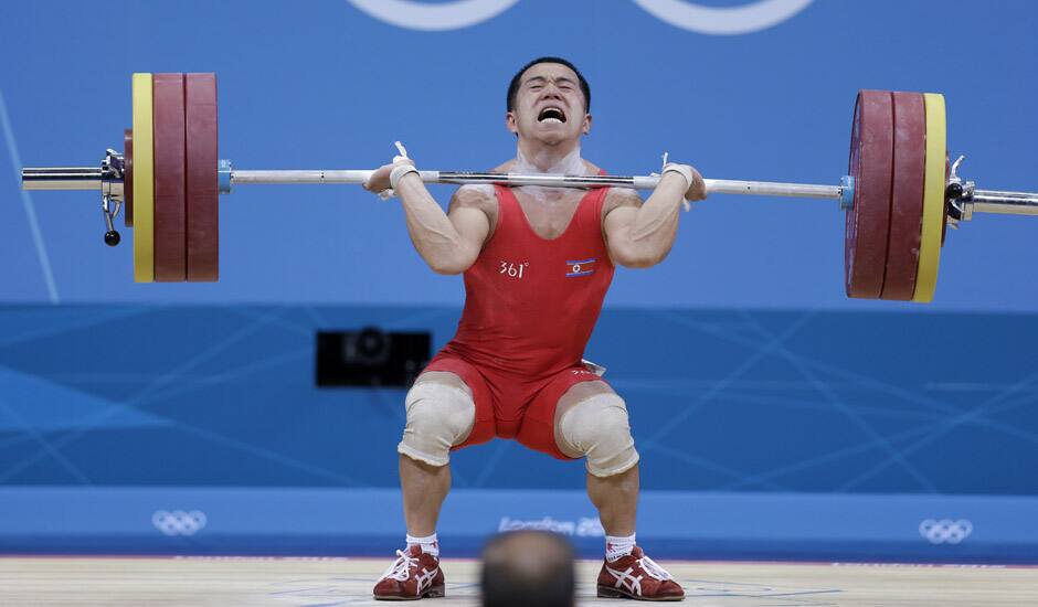 North Korea's Yun Choi Om lifts during the men's 56-kg, group B, weightlifting competition at the 2012 Summer Olympics in London.