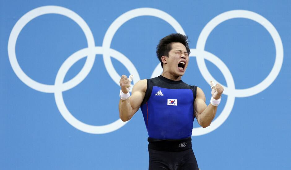 Won Jeongsik of South Korea reacts while competing during the men's 69-kg, group A, weightlifting competition at the 2012 Summer Olympics in London.