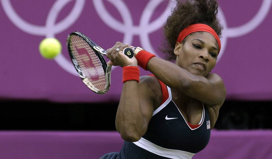 Serena Williams of the United States returns to Vera Zvonareva of Russia at the All England Lawn Tennis Club in Wimbledon, London at the 2012 Summer Olympics.