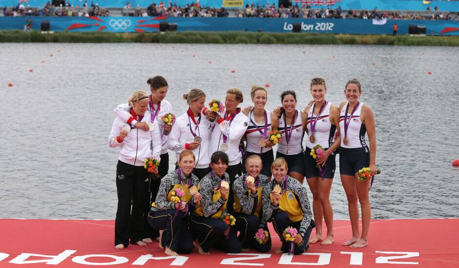 Winners of the women's rowing quadruple sculls final pose with their medals in Eton Dorney, near Windsor, England, at the 2012 Summer Olympics. Gold medal winners from the Ukraine are at bottom, silver medal winners from Germany at left, and bronze medal winners from the U.S