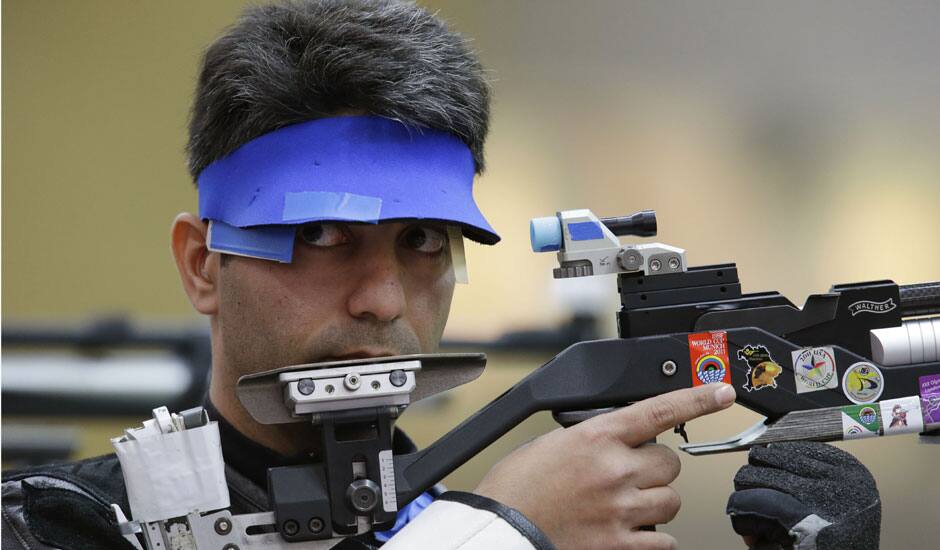 ndia's Abhinav Bindra shoots during qualifiers for the men's 10-meter air rifle event at the 2012 Summer Olympics, Monday, July 30, 2012, in London.