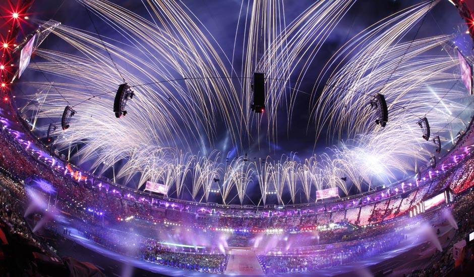 This photo taken with a fisheye lens, pyrotechnics illuminate the sky above the Olympic Stadium during the Closing Ceremony at the 2012 Summer Olympics.