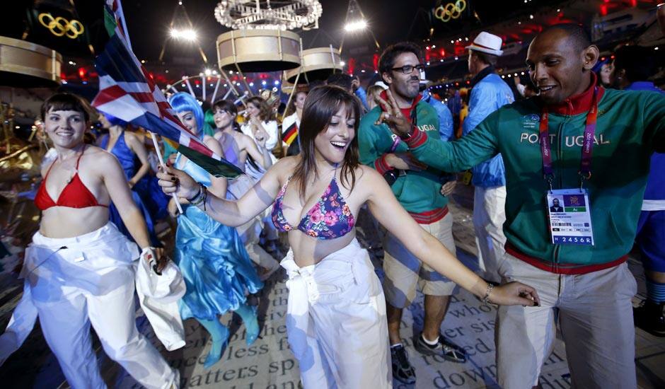 Portugal's Nuno Delgado, dances with performers during the Closing Ceremony at the 2012 Summer Olympics in London.