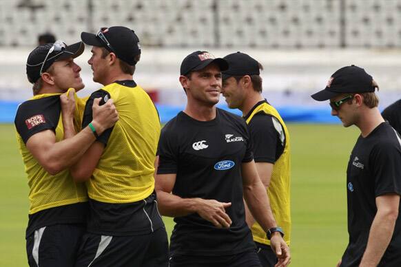 New Zealand bowler Tim Southee, second from left, is engaged in a mock fight with a teammate during a practice session in Hyderabad.