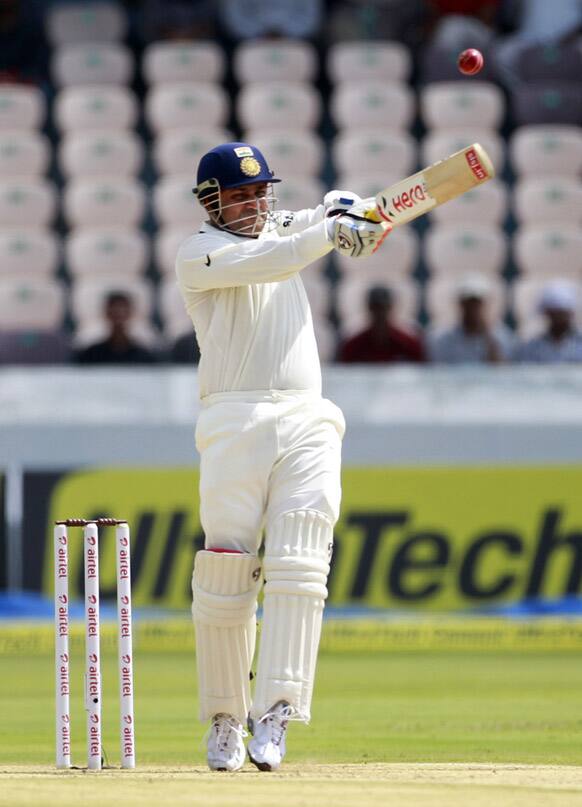 Virender Sehwag plays a shot during the first day of the first test cricket match against New Zealand in Hyderabad.