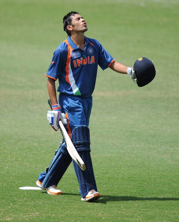 Prashant Chopra of India walks off after losing his wicket for 52 runs against New Zealand during their ICC U19 Cricket World Cup 2012 semi-final match, in Townsville, Australia.