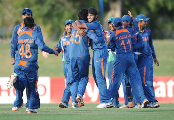 Indian team celebrates victory against New Zealand during their ICC U19 Cricket World Cup semi-final match, in Townsville, Australia.