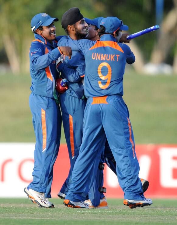 Ravi Kant Singh of India celebrates with teammates their victory against New Zealand during their ICC U19 Cricket World Cup semi-final match, in Townsville, Australia. 