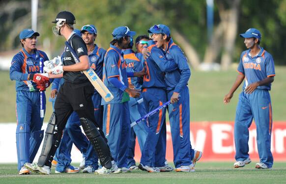 Indian team celebrates victory against New Zealand during their ICC U19 Cricket World Cup semi-final match, in Townsville, Australia.