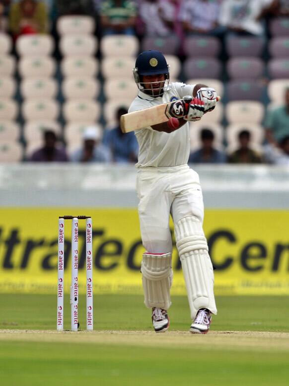 Cheteshwar Pujara bats during the second day of the first cricket test match against New Zealand in Hyderabad.