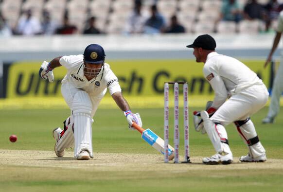 Mahendra Singh Dhoni runs for the crease during the second day of the first cricket test match against New Zealand in Hyderabad.