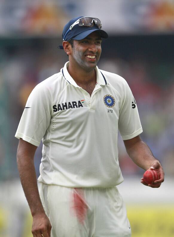 Ravichandran Ashwin gestures as he leaves the ground after taking six wickets in New Zealand's first innings during their third day of the first cricket test match in Hyderabad.