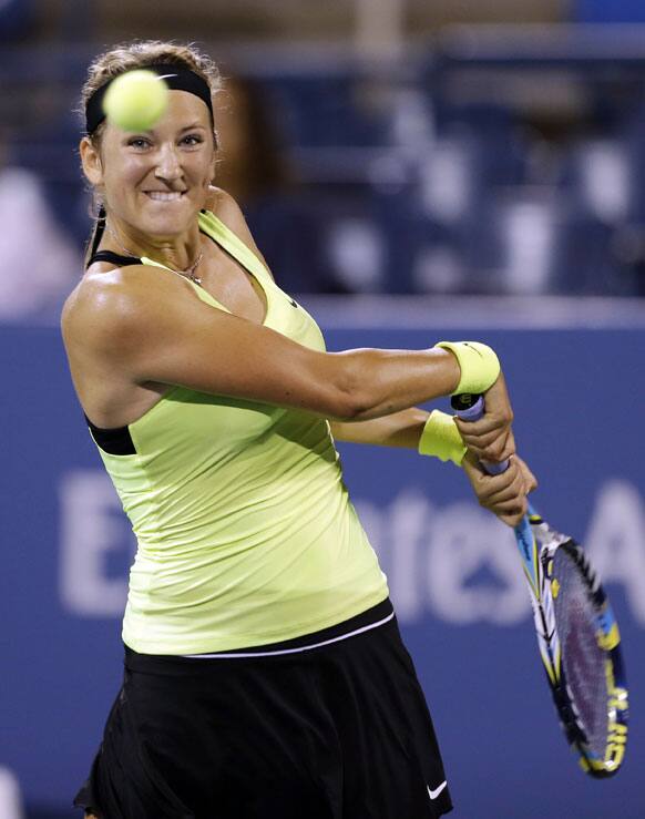 Victoria Azarenka, of Belarus, returns a shot to Alexandra Panova, of Russia, in a match at the U.S. Open tennis tournament  in New York. 