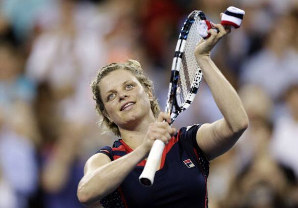 Kim Clijsters, of Belgium, thanks the crowd after defeating Victoria Duval 6-3, 6-1 in the first round of play at the U.S. Open tennis tournament in New York. 