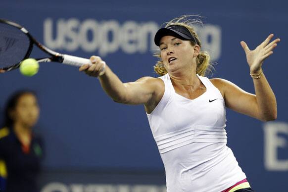 Coco Vandeweghe returns a shot to Serena Williams during a match at the U.S. Open tennis tournament.