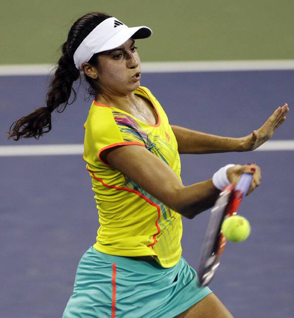 Christina McHale returns to Kiki Bertens, of the Netherlands, in the first round of play at the U.S. Open tennis tournament.