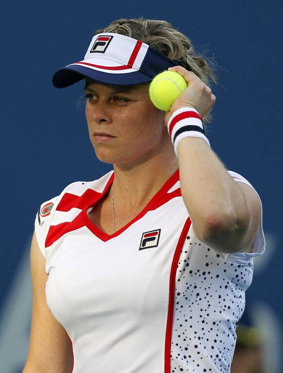 Kim Clijsters of Belgium pauses during her match with Laura Robson of Great Britain in the second round of play at the 2012 US Open tennis tournament.