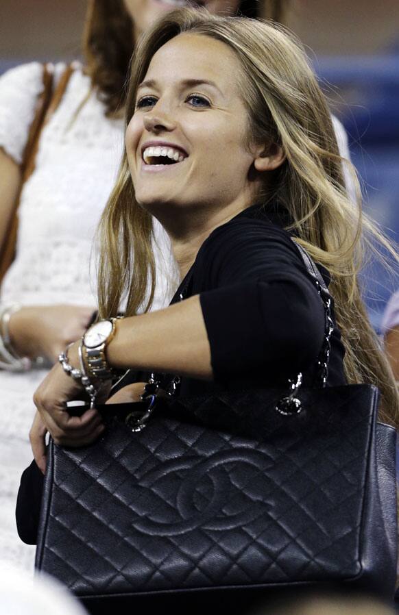 Kim Sears, Andy Murray's girlfriend, smiles as Murray is interviewed following his 6-2, 6-1, 6-3 win over Ivan Dodig, of Croatia, in the second round of play at the US Open tennis tournament.